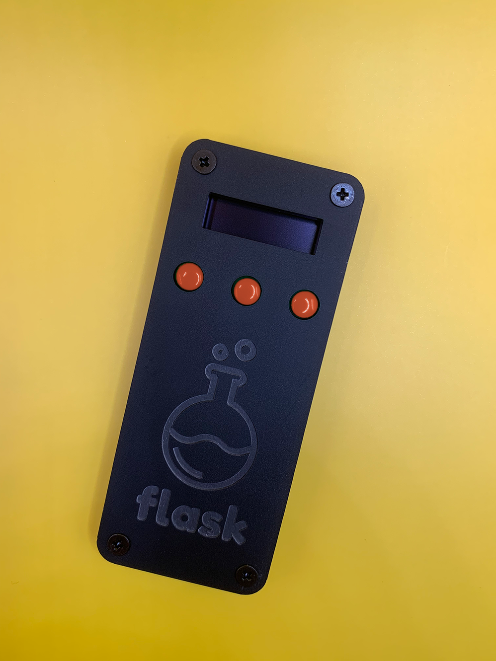 Black Flask with Red Buttons